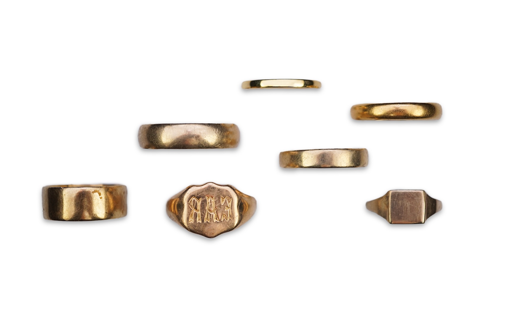 A collection of seven gold rings